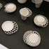 木村 夏海さんの陶器「ヒカリ ト　カゲ ト　カタチ」。鋳こみ成形で基本の形をつくり、それから手のおもむくままに形づくった作品　（2012.2.9撮影）