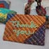 アーティスト・のむらみちことの協同アイテム「handmade envelope」。時間をかけて、障害者施設で織られた織物。　（2012.2.9撮影）